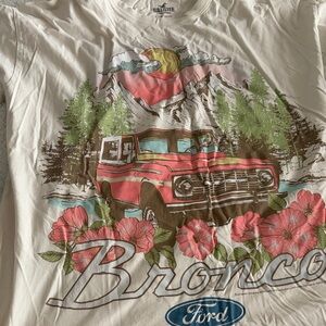 Hollister White T-Shirt with Red and Green Bronco Design